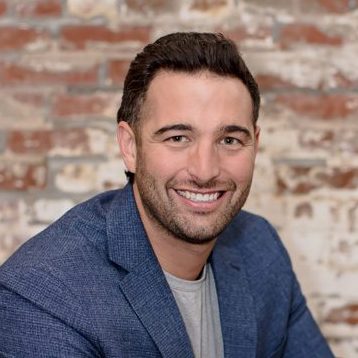 Headshot photo of Nate Hollensteiner showing shoulders and up.