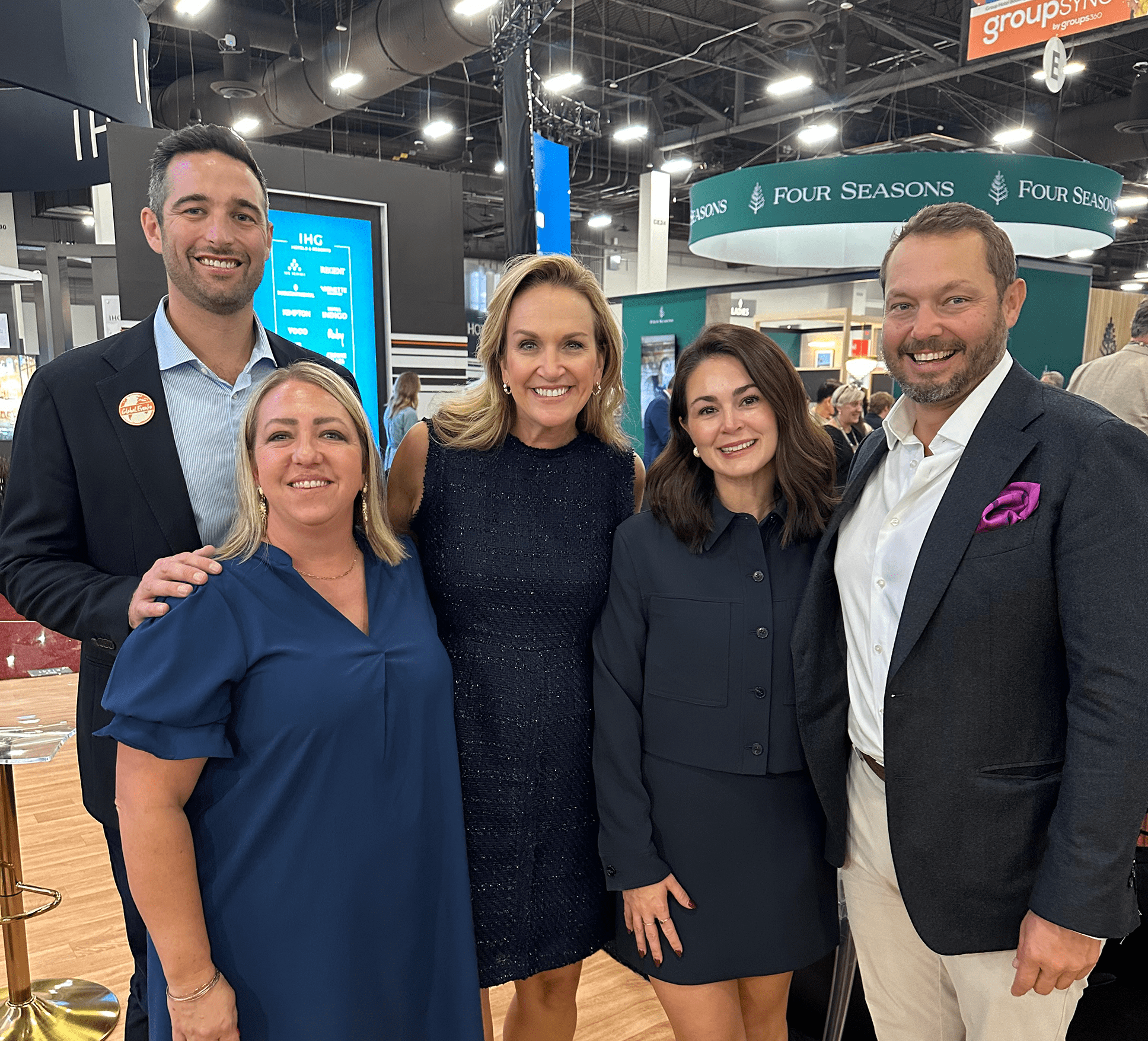 From left to right: Nate Hollensteiner, Mary Ann Moramarco, Jane Mower, Kayla Thuston and Patrick Corley stand together at the 2025 IMEX Trade Show.